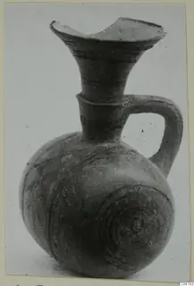 Pottery Black-on-Red I-III jug from Amathus, tombs 1–9, with a flaring mouth and strap handle