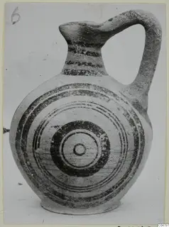White Painted V jug from Amathus, with dark painted bands on the neck and concentric circles on the body