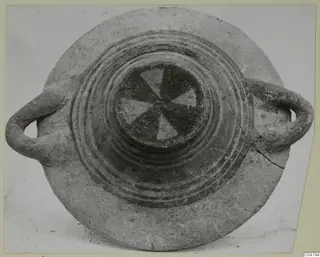 Pottery Bichrome III vessel from Amathus, seen from above, with two loop handles and a pinwheel pattern in the centre