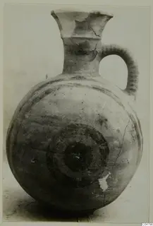 Pottery Bichrome I jug from Amathus with a flared neck, strap handle and dark concentric circles on the body