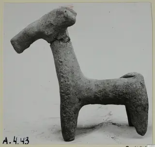 Small clay figurine of a four-legged animal with a long neck and head, from Amathus