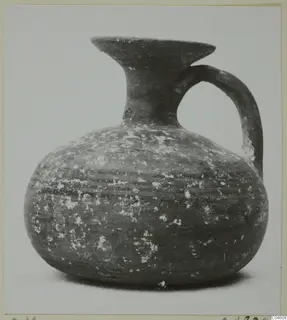 Round-bodied jug with a flared mouth and single loop handle, from the painted pottery series