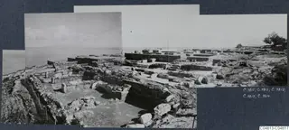 Overview of Vouni Palace ruins: stone walls and foundations on a hilltop, with the sea beyond.