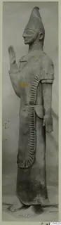 Terracotta statue of a standing bearded figure with a raised hand, Terracotta Proto-Cypriote II