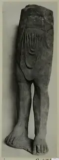 Terracotta figure of legs and lower body with curved relief lines on the torso; upper part broken away