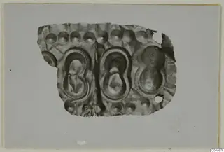 Embossed metal sheet fragment from Enkomi with two large oval panels and rows of round bosses