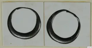 Two views of a thick hooped ring, mounted side by side on a card