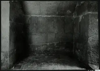Interior of a stone chamber at Amathus, with large rectangular blocks forming the walls and a flat stone floor