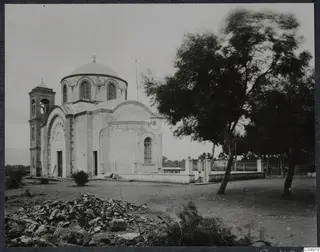 Greek Orthodox church of Panagia Faneromeni in Kition, with a dome, bell tower and a tree at right.