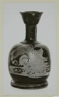 Small pottery vessel with a flared neck and a pale figured band with a winged animal on its body