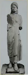 Limestone statue of a woman from Vouni, standing with arms at her sides, one forearm broken off