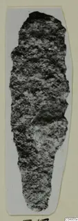 Corroded iron arrow-head from Amathus, long and narrow, tapering to a rounded lower end