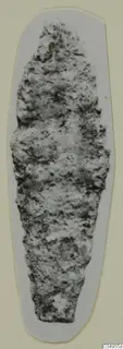 Corroded iron arrowhead from Amathus, elongated and pointed, shown against a grey card backing