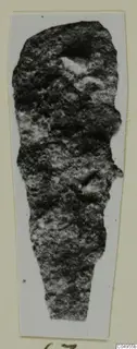 Corroded iron arrowhead from Amathus, shown on a pale card mount