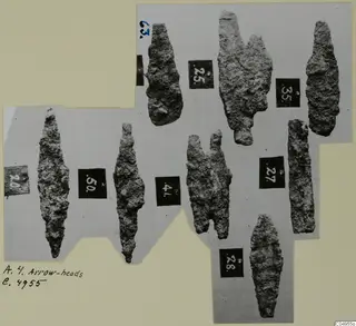 Iron arrow-heads from Amathus with numbered labels, photographed on a grey card mount