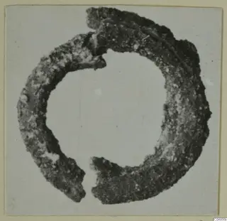 Corroded bronze ring-shaped adornment from Amathus, broken with a gap at the lower side