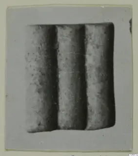 Three cylindrical objects set side by side, close view, from Amathus