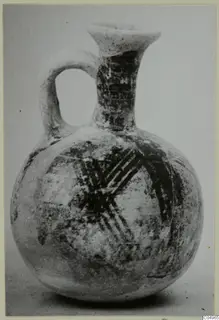 Pottery Bichrome Wheel-made jug with a loop handle and dark painted bands, from Milia