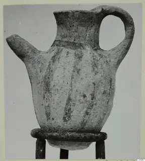 White Painted IV-V jug from Milia with a beak spout, strap handle and dark painted vertical stripes