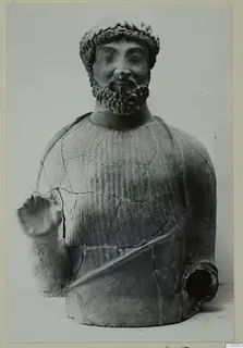 Terracotta bust of a bearded man with a leaf-like headband, one arm raised, and a spout at the lower right.
