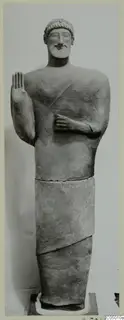 Full-length statue of a bearded man with his right hand raised, from Mersinaki