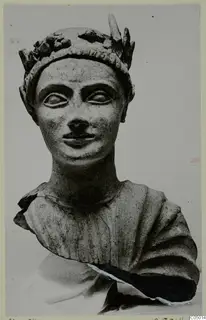 Sculpted bust of a figure with a leafy wreath on the head, shown from the front