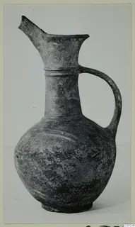 Pottery Base-Ring Ware jug with a single handle and a broken spout
