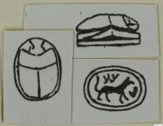 Drawings of three seals: two beetle-shaped scarabs and an oval seal showing a four-legged animal and signs