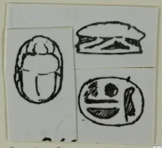Ink drawing of a scarab seal in three views: back, side profile and flat base.