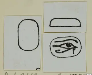 Ink drawings of three seal or scarab designs on mounted cards: a tall rounded outline, a flat oval and an eye-shaped sign.