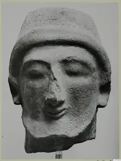 Head of a statue from Mersinaki with closed eyes, a flat-topped headdress and a prominent nose