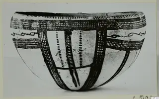Bowl of White Slip Ware with dark painted bands, cross-hatching and dotted vertical lines