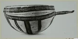Bowl of White Slip Ware from Enkomi with dark painted bands and a long handle