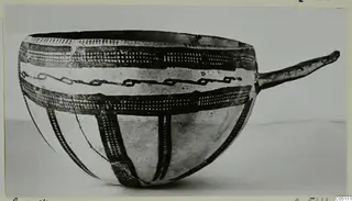 Pottery White Slip Ware bowl from Enkomi with a long side handle and dark painted bands