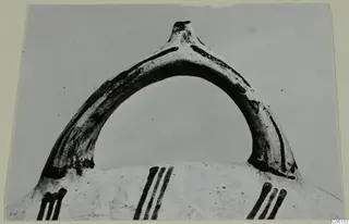 Handle of a White Slip Ware vessel with painted vertical strokes on the body below, from Enkomi