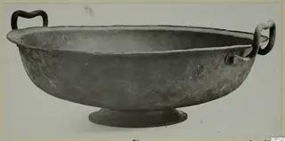 Metal bowl with two handles and a low foot, from Marion.