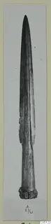 Metal sword blade from Amathus, photographed upright against a plain background on a card mount.