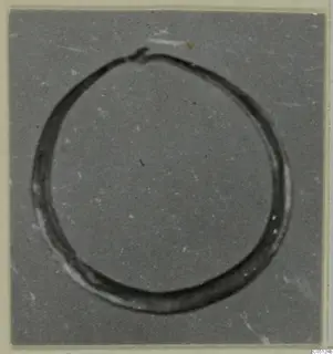 Single ring-shaped find from the Kastros tombs at Lapithos, photographed on a grey card