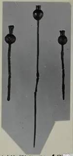 Three metal pins with globular heads from the Kastros tombs at Lapithos, on a grey mount