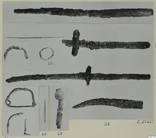 Mounted photographs of corroded iron blades, a small ring and other iron objects, with blue numbered labels.