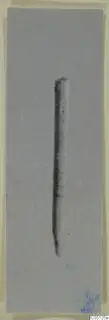 Bone pin from the Kastros tombs at Lapithos, photographed on a plain grey background
