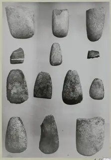 Thirteen stone implements from the Neolithic Settlement, Kythrea and Lapithos, arranged in four rows on a grey background