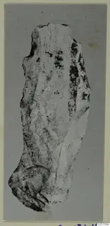Knife of stone from Petra tou Limniti, photographed upright on a grey mount