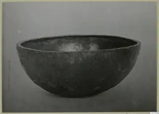 Bowl from the Kastros tombs at Lapithos, shown in side view against a plain grey backdrop