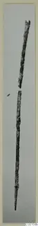 Two corroded bronze tool fragments, long thin rods with one tapering to a point, from Lapithos