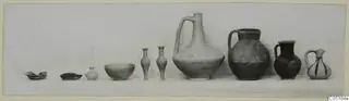 Row of pottery vessels from Kountoura Trachonia, Tomb 14, set out in a line by size on a pale surface.