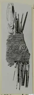 Bone comb from Lapithos, Kastros tombs, with a band of scroll and circle pattern and long teeth
