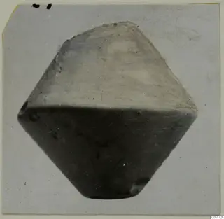Stone spindle whorl from Lapithos, shown against a plain light background