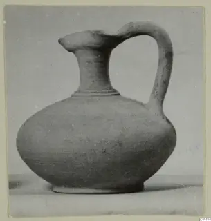 Pottery jug with a pointed spout and a single loop handle, from Kountoura Trachonia, Tomb 11.
