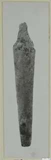Bronze knife blade from Lapithos, Vrysi tou Barba tombs, photographed upright with a handwritten number label